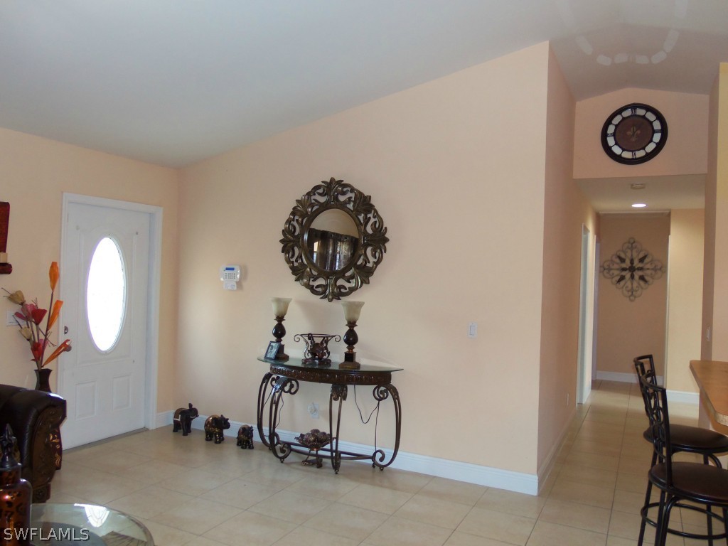 462 Rajah Street Lehigh Acres, FL 33974 - Photo 2 of 17 a view of a room with gym equipment
