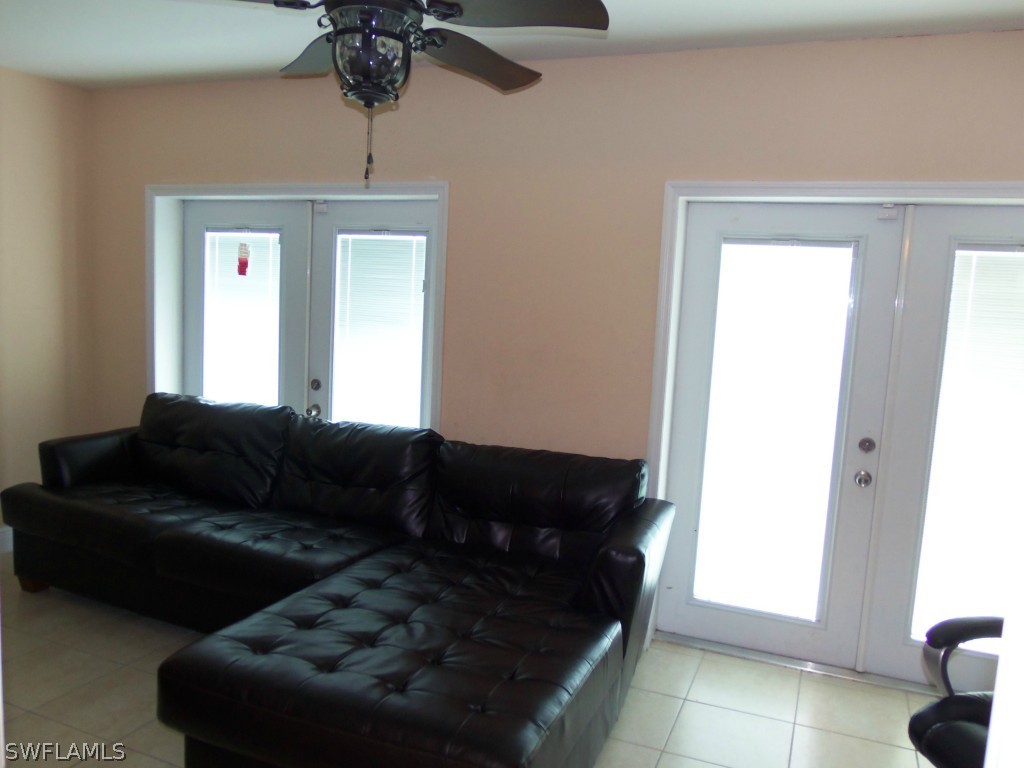 462 Rajah Street Lehigh Acres, FL 33974 - Photo 10 of 17 a living room with furniture and a window