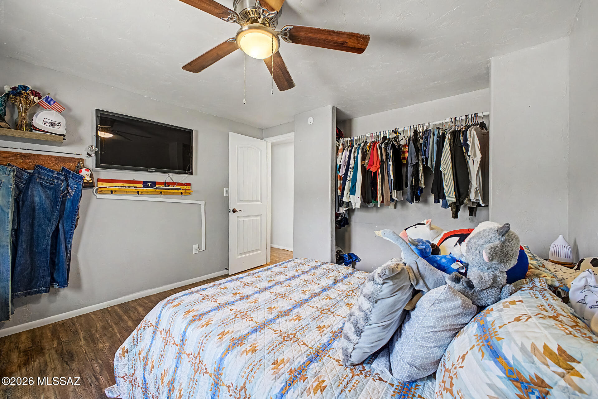 4231 East Pinal Street Tucson, AZ 85739 - Photo 17 of 36 a bedroom with a bed and a view of walk in closet
