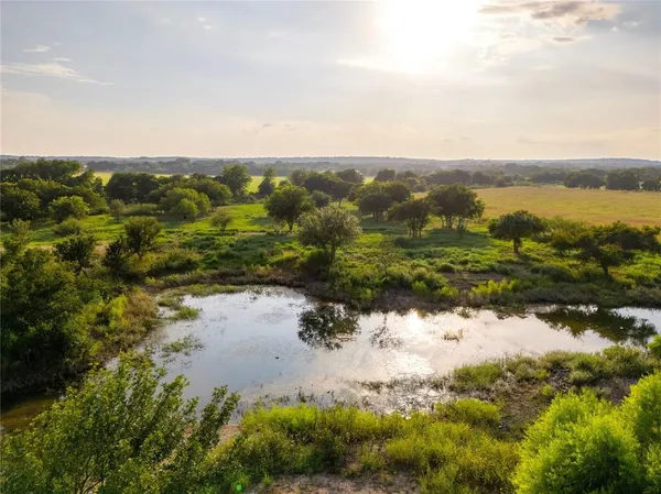 a view of a lake from a yard