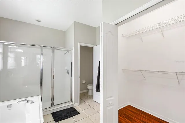 a bathroom with a shower and a sink