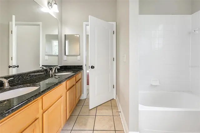 a bathroom with a bathtub and a sink