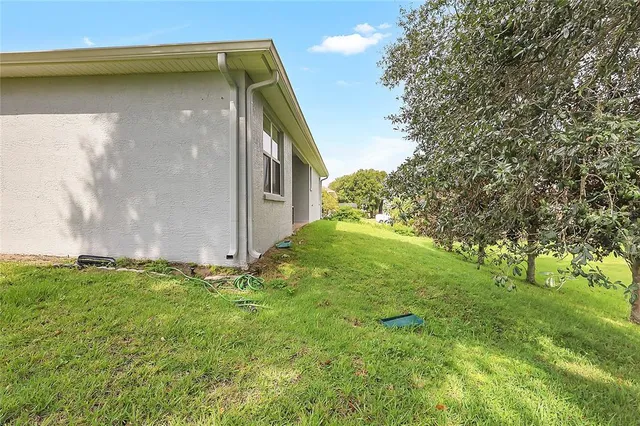 a backyard of a house with lots of green space