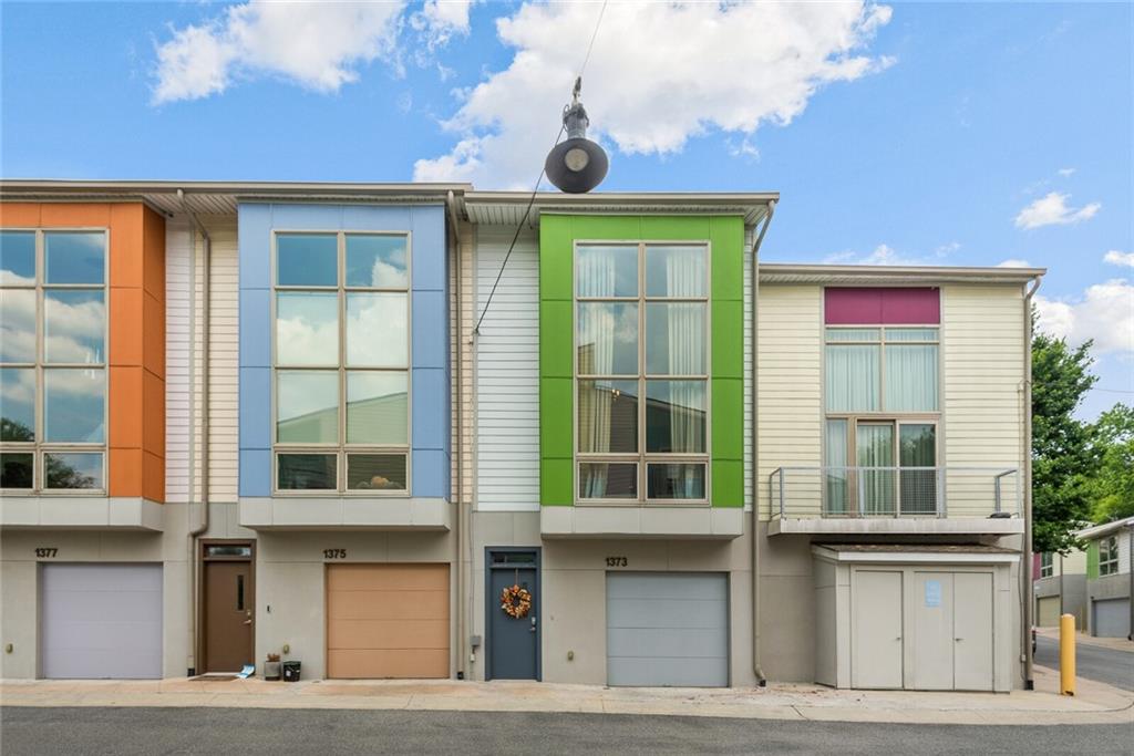 1373 Rietveld Row Northwest Atlanta, GA 30318 - Photo 1 of 1 a front view of a multi story building