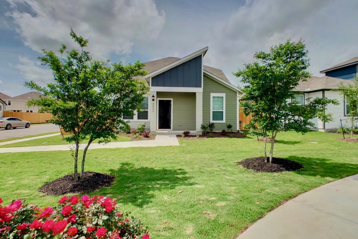 a house view with a garden space