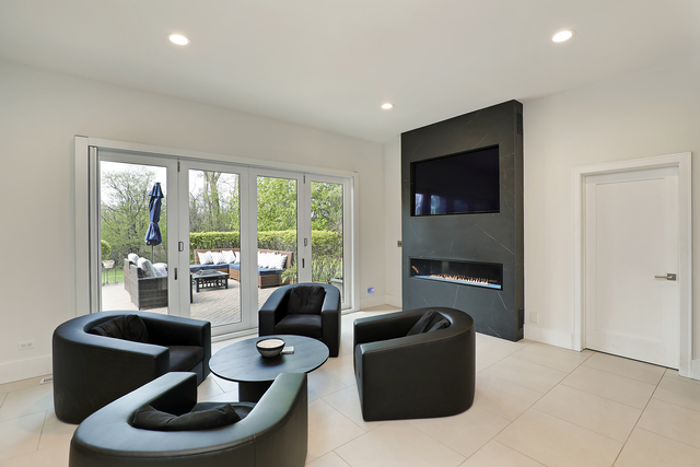 1630 Ridge Road Highland Park, IL 60035 - Photo 20 of 63 a living room with furniture and a floor to ceiling window