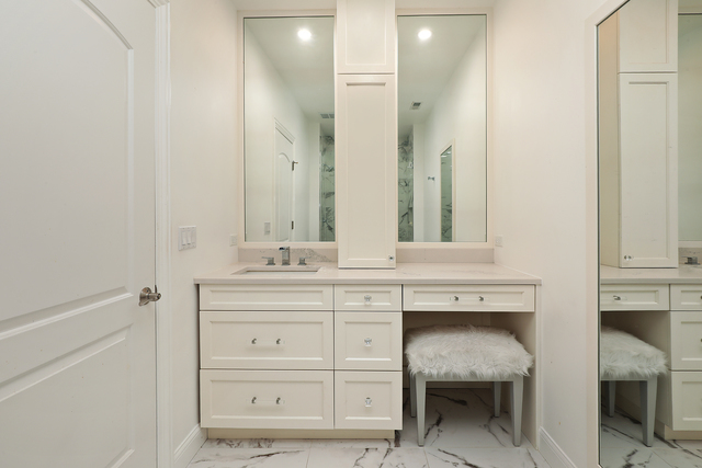 1630 Ridge Road Highland Park, IL 60035 - Photo 36 of 63 a bathroom with a sink and a mirror