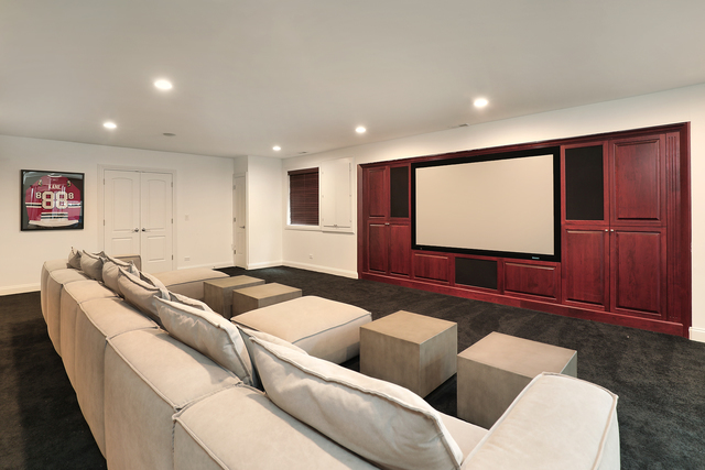 1630 Ridge Road Highland Park, IL 60035 - Photo 50 of 63 a living room with furniture and a flat screen tv