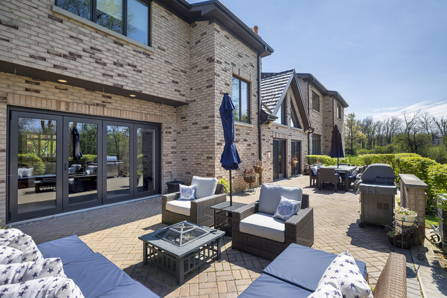 1630 Ridge Road Highland Park, IL 60035 - Photo 52 of 63 a outdoor living space with furniture flat screen tv and a fireplace