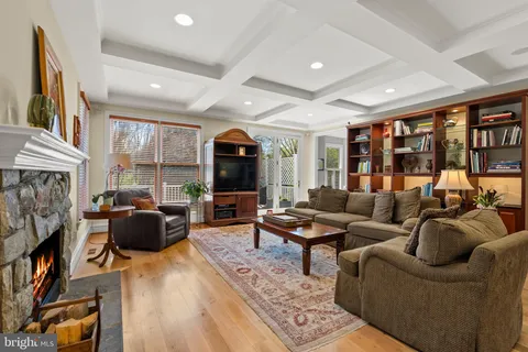 a living room with furniture fireplace and a flat screen tv