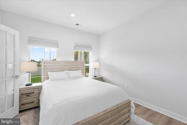 a bedroom with a bed and a dresser