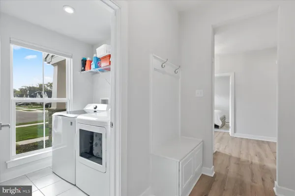 a view of storage and utility room with washer and dryer
