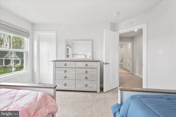 a view of a bedroom with cabinet