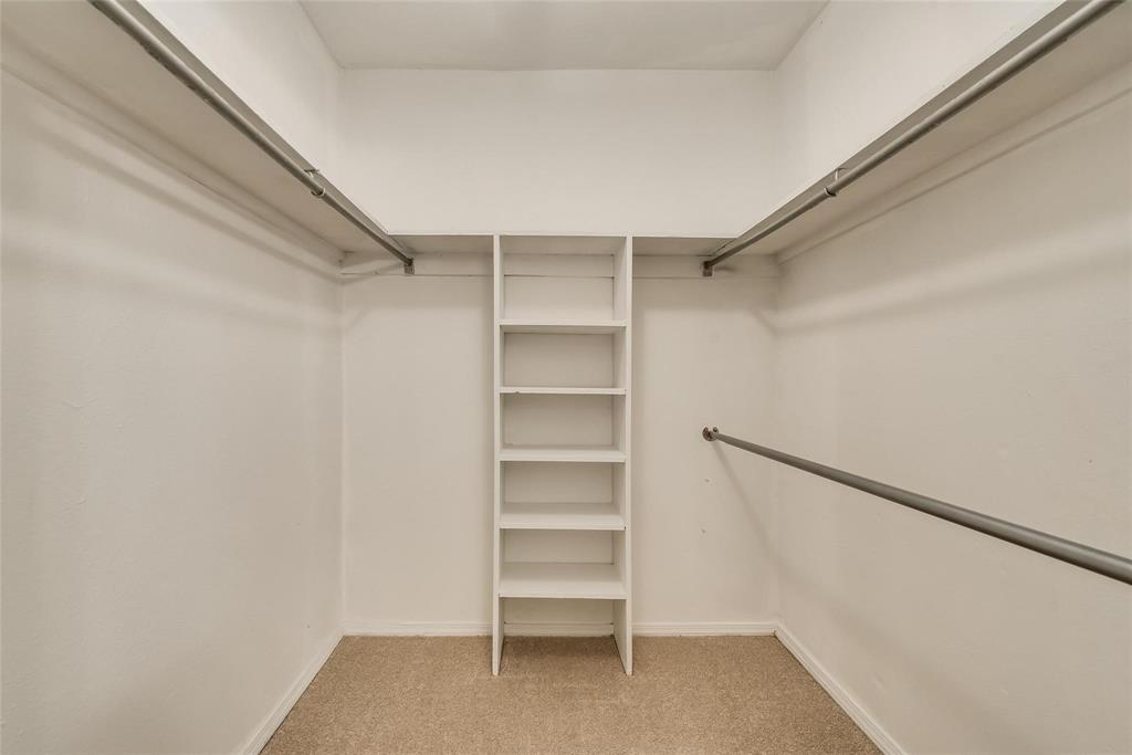 18240 Midway Road, Unit 302 Dallas, TX 75287 - Photo 24 of 33 a view of walk in closet with empty racks