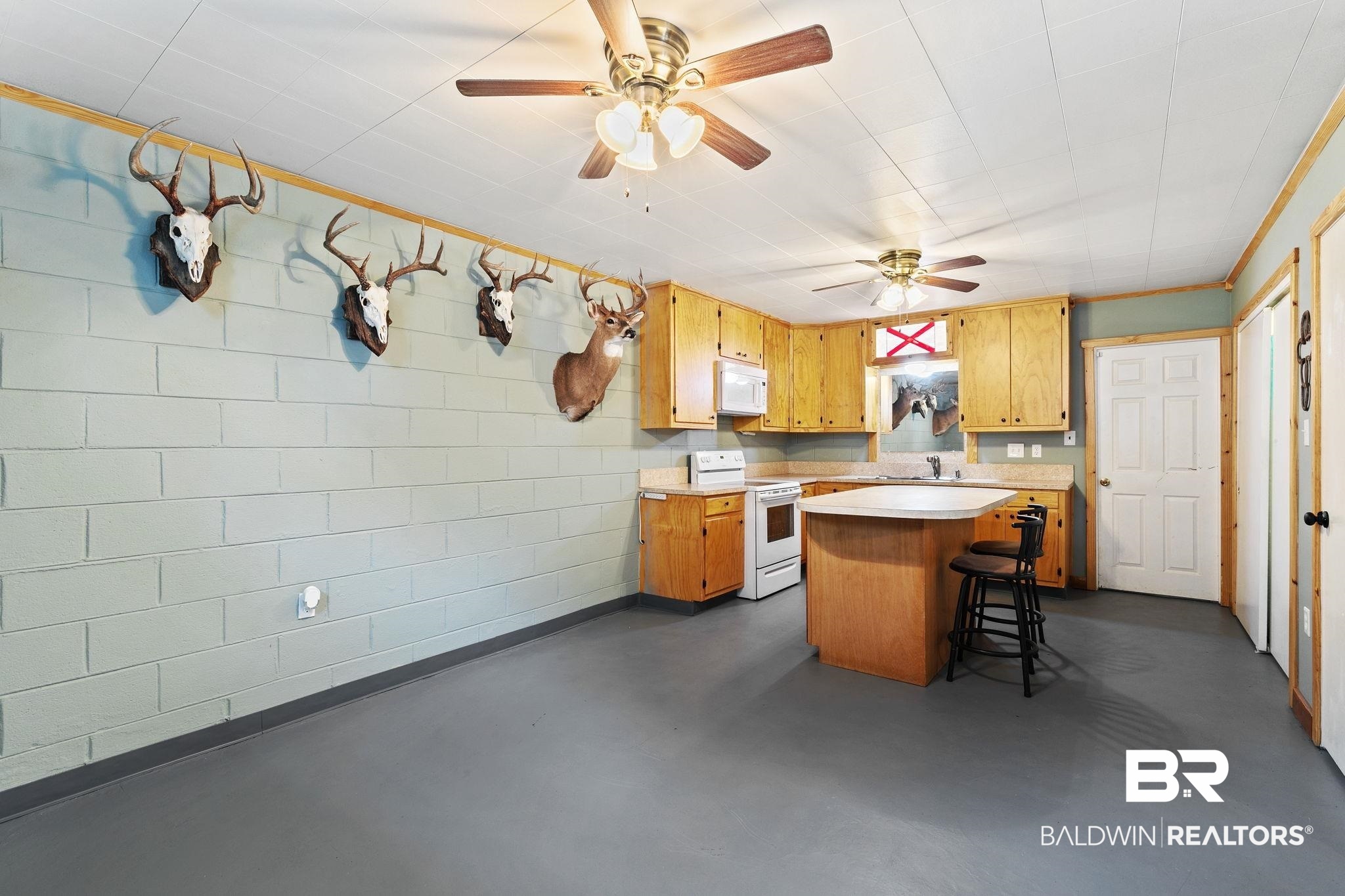 14 Lee Circle Daphne, AL 36527 - Photo 48 of 83 Kitchen with a breakfast bar, white appliances, kitchen peninsula, and ceiling fan