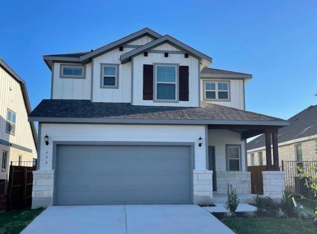 a front view of a house with garage