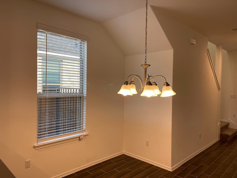 640 Pickrell Loop Georgetown, TX 78628 - Photo 14 of 36 a view of a room with wooden floor and windows