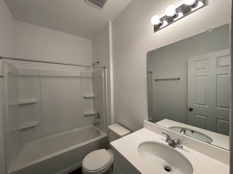 640 Pickrell Loop Georgetown, TX 78628 - Photo 17 of 36 a bathroom with a sink toilet and shower