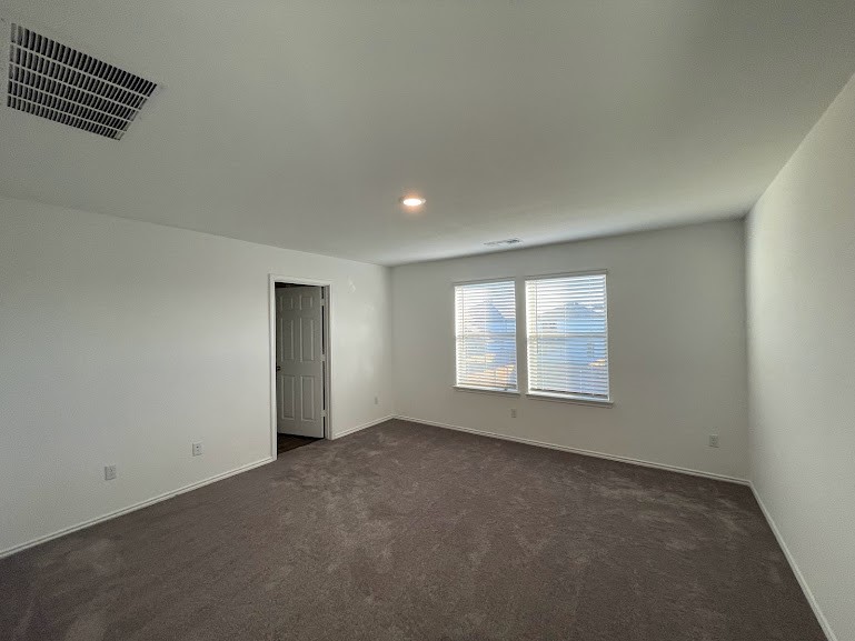 640 Pickrell Loop Georgetown, TX 78628 - Photo 18 of 36 an empty room with a empty space and windows