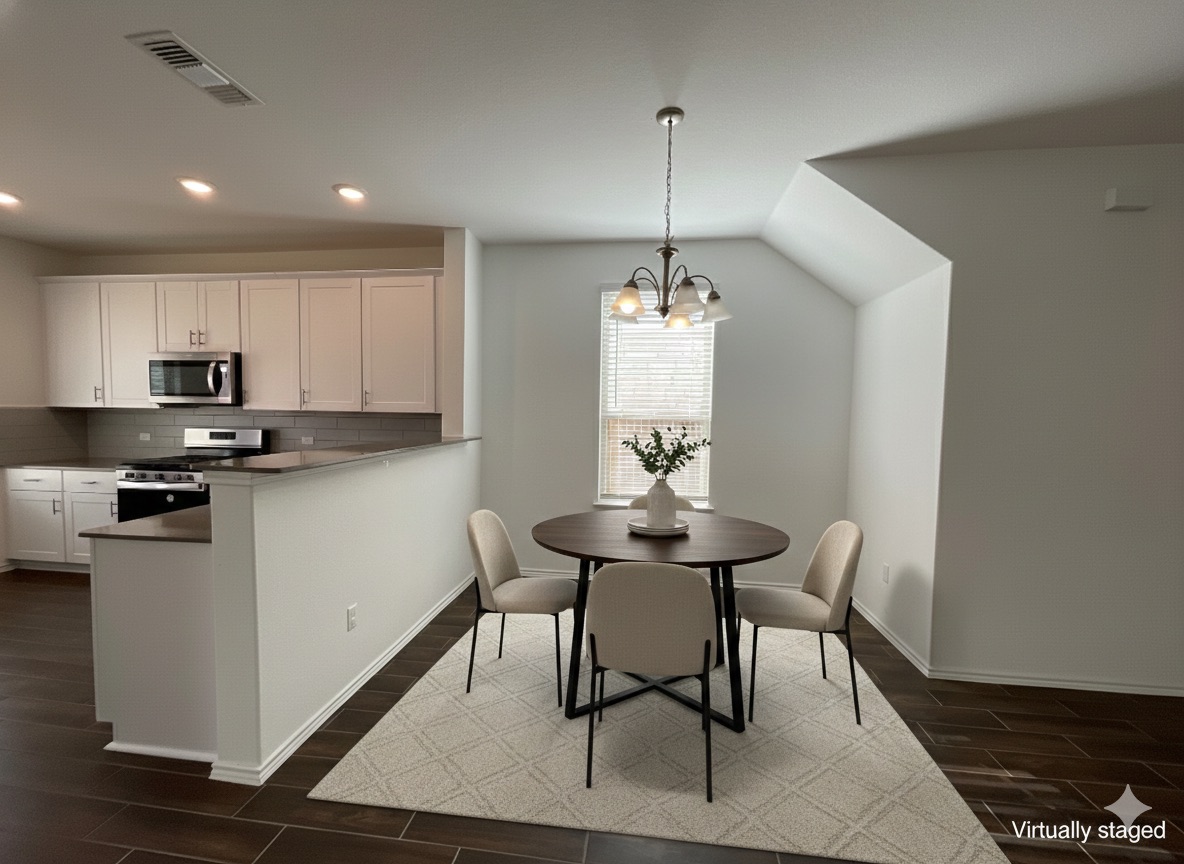 640 Pickrell Loop Georgetown, TX 78628 - Photo 6 of 36 a kitchen with stainless steel appliances kitchen island a stove a table and chairs in it