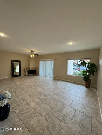a view of a livingroom with furniture and a flat screen tv