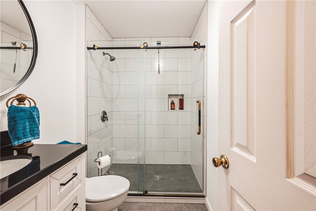 2001 Ridgeview Lane Seneca, SC 29678 - Photo 14 of 27 A sleek, contemporary bathroom with a glass-enclosed shower and modern vanity.