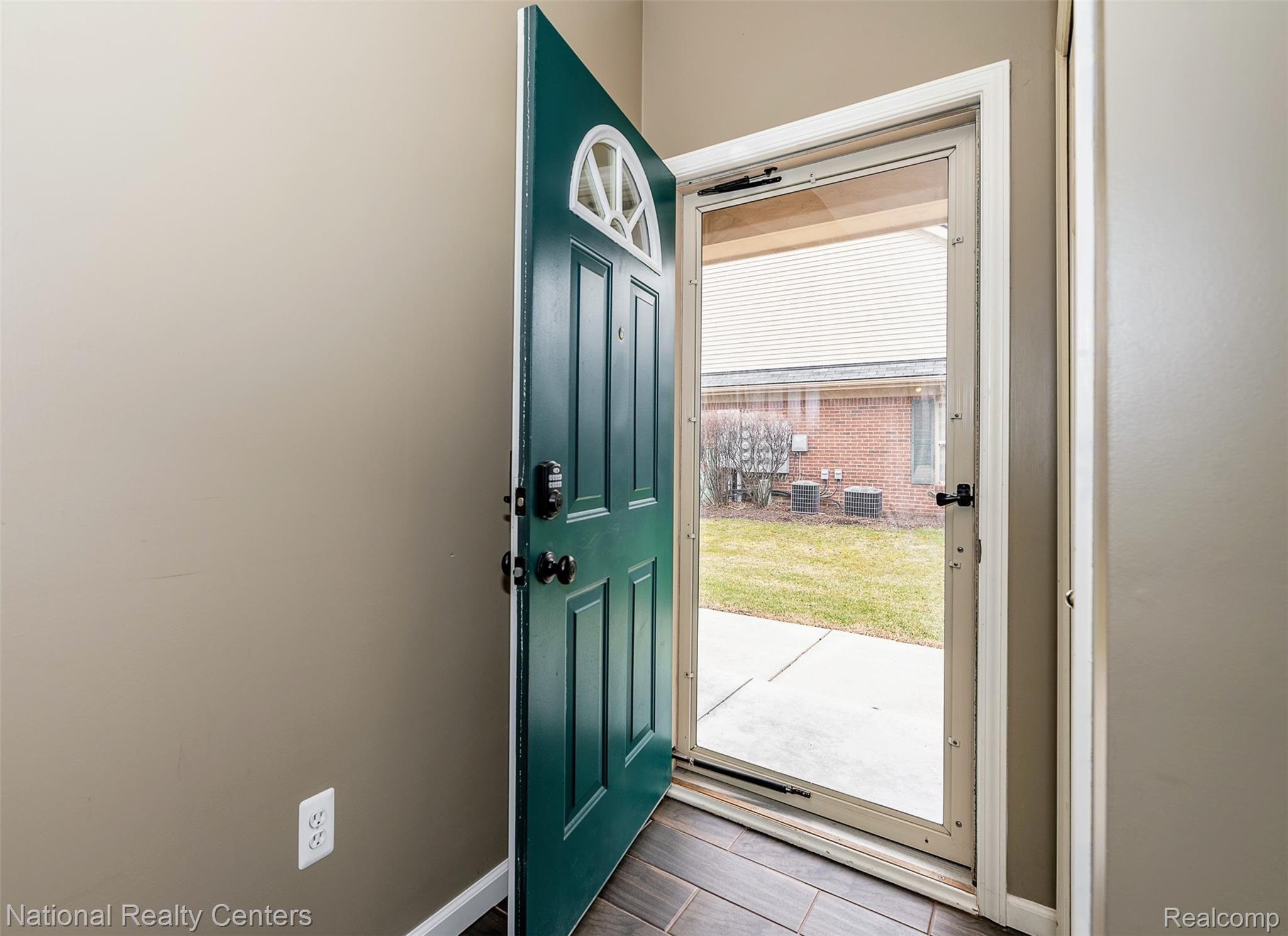 11740 Farmington Road Livonia, MI 48150 - Photo 5 of 31 Entrance with lock pad door and coat closet.