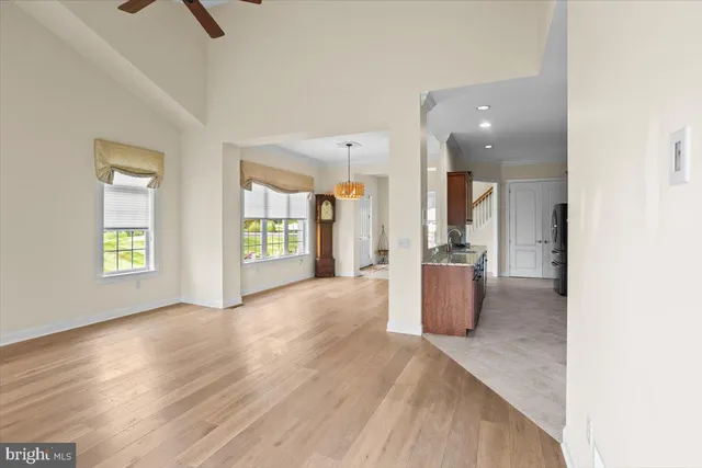 a open kitchen with cabinets and stainless steel appliances