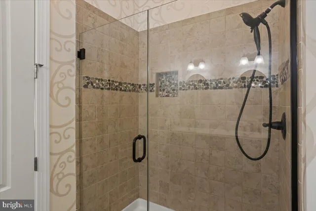 a bathroom with a double vanity sink mirror and toilet