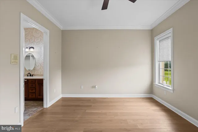 a front view of a house with a garden and pathway