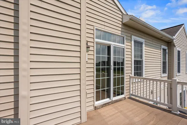 a view of a lake with a house in the background
