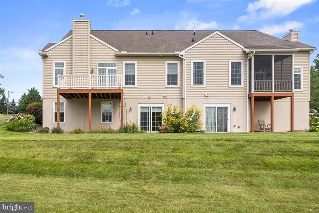 a view of a house with a big yard and plants
