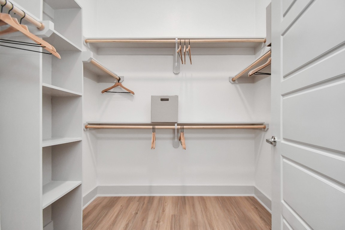 1617 Enid Street, Unit 318 Houston, TX 77009 - Photo 19 of 50 a view of walk in closet with empty racks