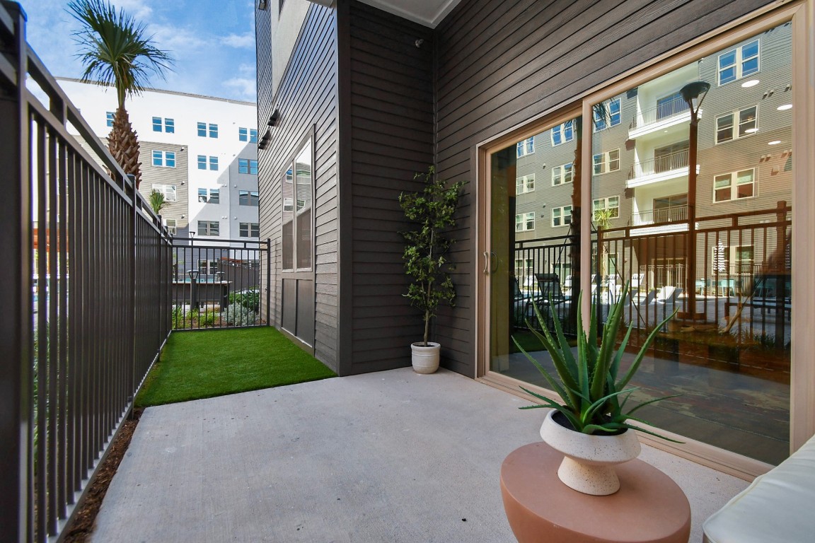 1617 Enid Street, Unit 318 Houston, TX 77009 - Photo 36 of 50 a potted plant sitting in front of a building