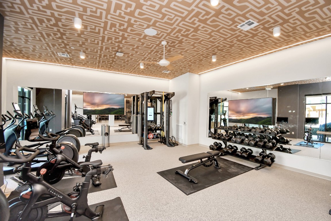 1617 Enid Street, Unit 318 Houston, TX 77009 - Photo 38 of 50 a room with gym equipment and a large window