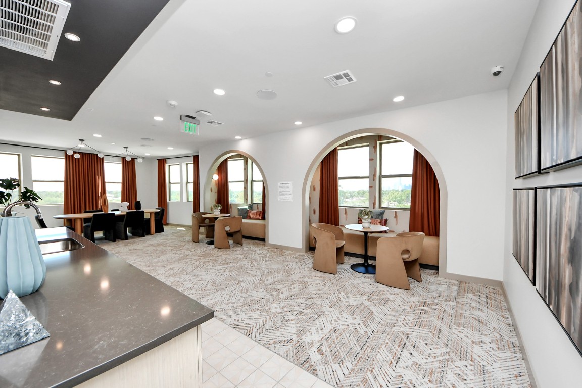 1617 Enid Street, Unit 318 Houston, TX 77009 - Photo 41 of 50 a large room with lots of table and chairs