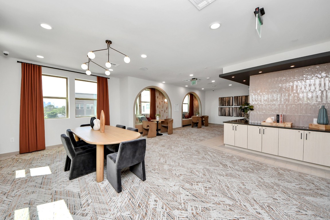 1617 Enid Street, Unit 318 Houston, TX 77009 - Photo 42 of 50 a large kitchen with a table and chairs in it