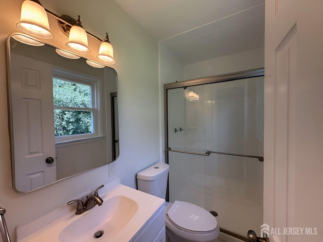 12 Ziff Lane West Windsor, NJ 08550 - Photo 11 of 19 a bathroom with a sink toilet and shower