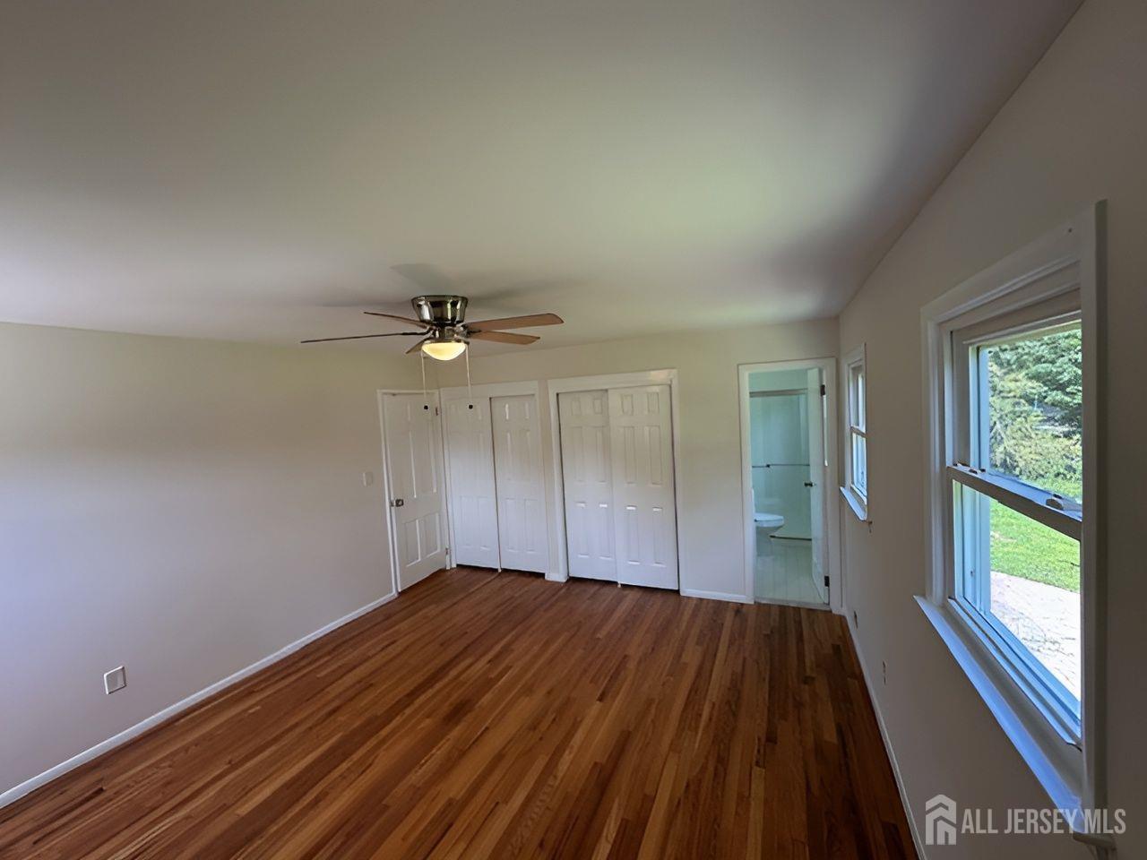 12 Ziff Lane West Windsor, NJ 08550 - Photo 13 of 19 wooden floor in an empty room with a window