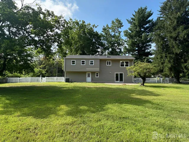 a view of a house with a big yard