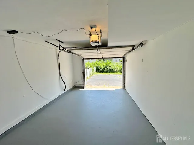 a view of storage and utility room with a window
