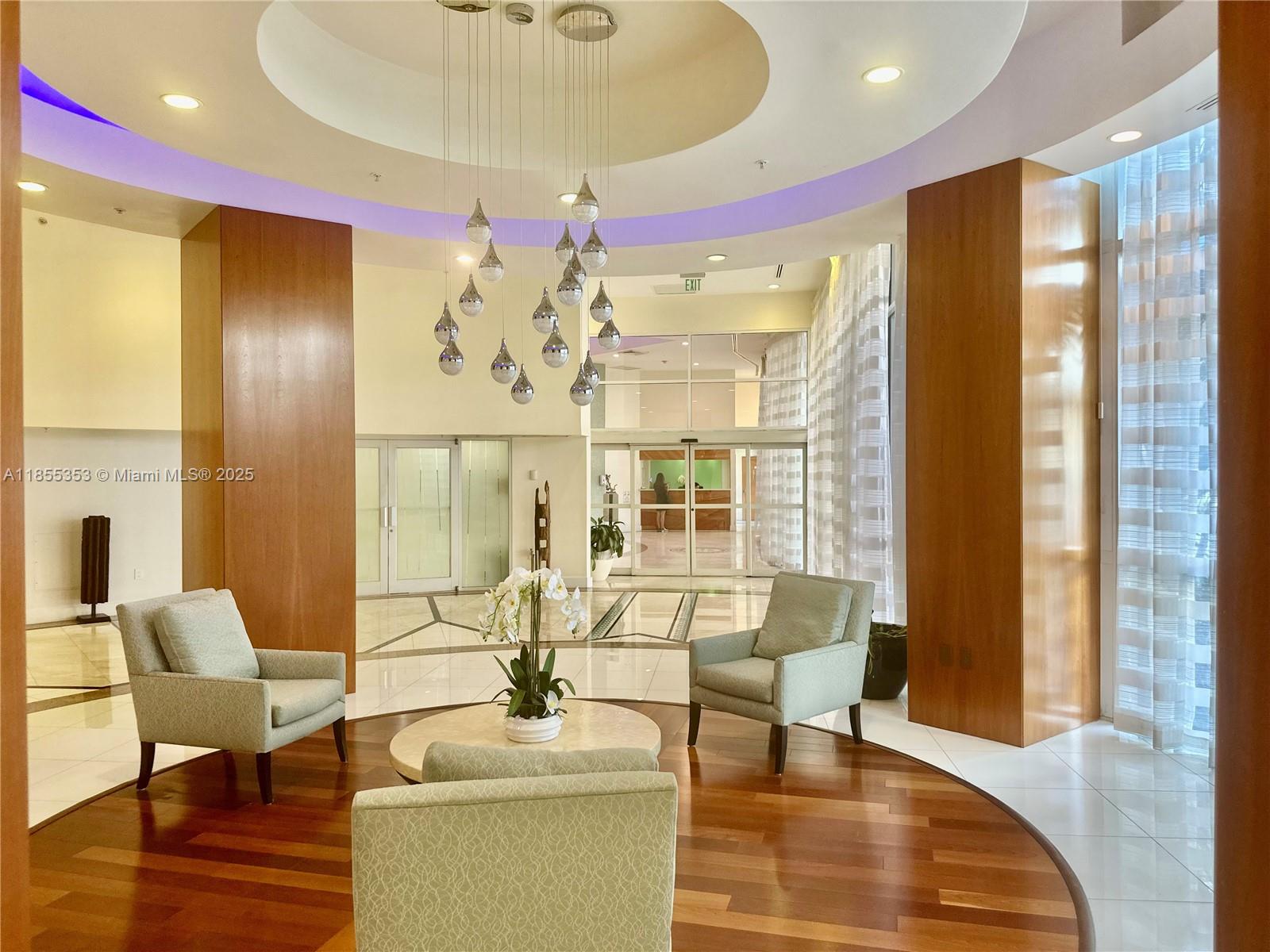 6301 Collins Avenue, Unit 806 Miami Beach, FL 33141 - Photo 18 of 26 a living room with furniture and a large window