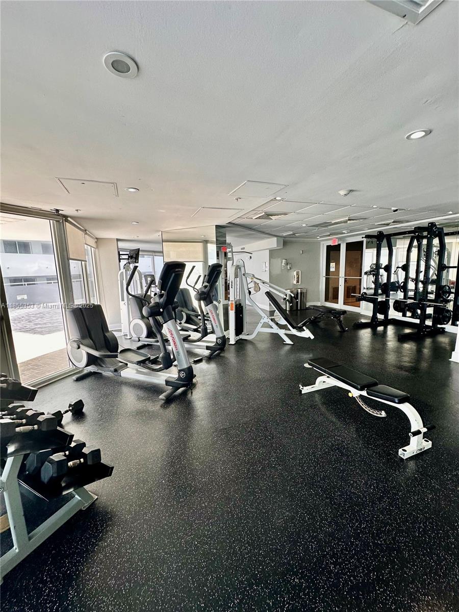 6301 Collins Avenue, Unit 806 Miami Beach, FL 33141 - Photo 25 of 26 a view of a room with gym equipment