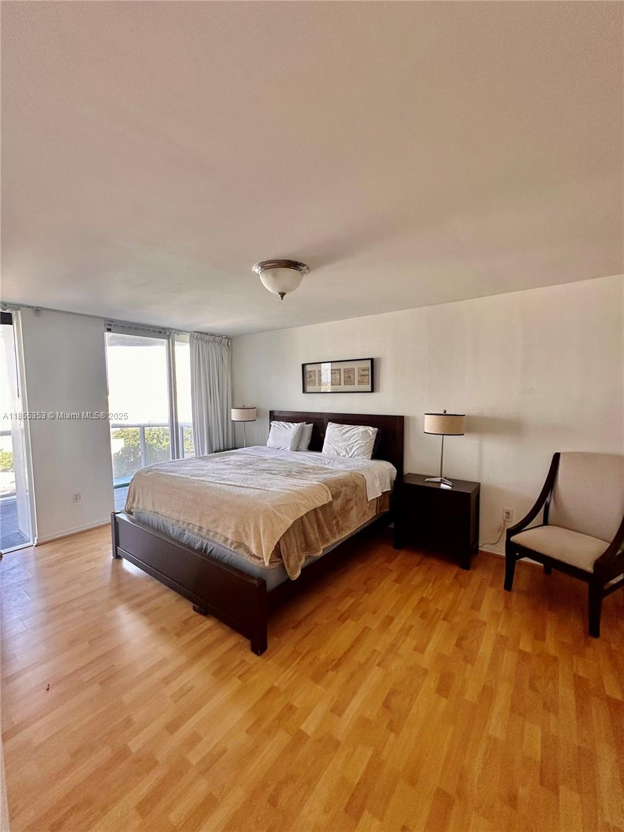 6301 Collins Avenue, Unit 806 Miami Beach, FL 33141 - Photo 8 of 26 a bedroom with a bed and window