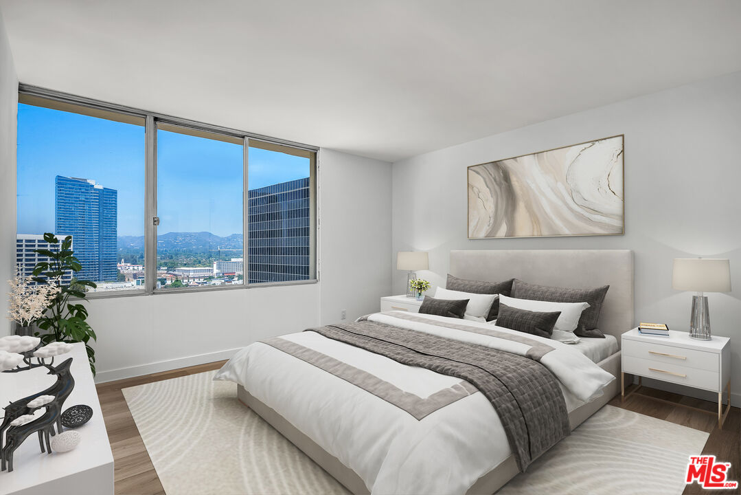 2160 Century Park, Unit 1911 Los Angeles, CA 90067 - Photo 13 of 26 a bedroom with a bed and window