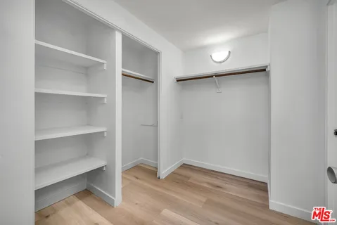 a view of an empty walk in closet