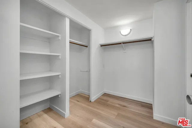 a view of an empty walk in closet