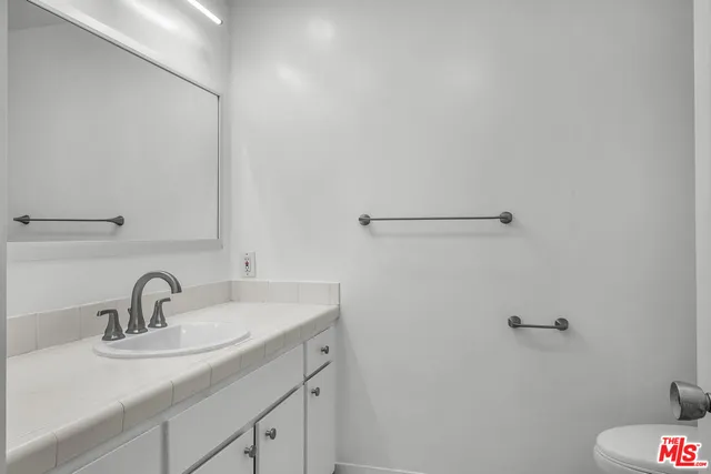 a bathroom with a sink and mirror