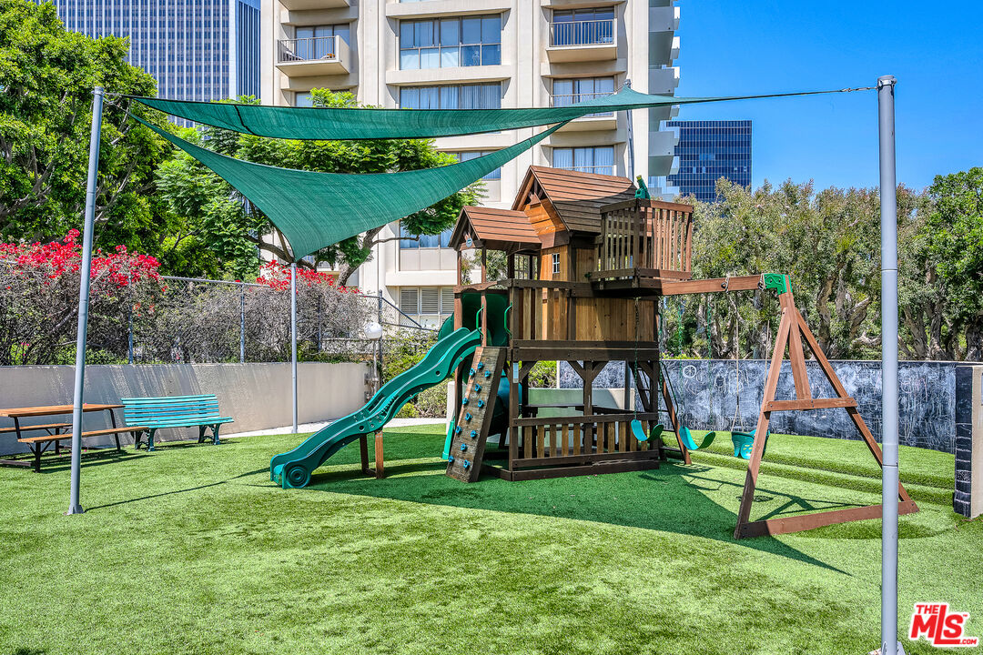 2160 Century Park, Unit 1911 Los Angeles, CA 90067 - Photo 25 of 26 a view of a house with a yard and potted plants