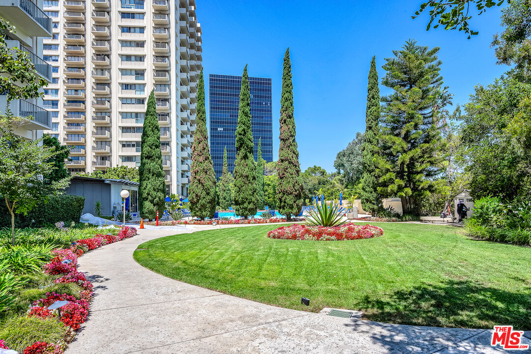 2160 Century Park, Unit 1911 Los Angeles, CA 90067 - Photo 26 of 26 a front view of a multi story building with yard and green space